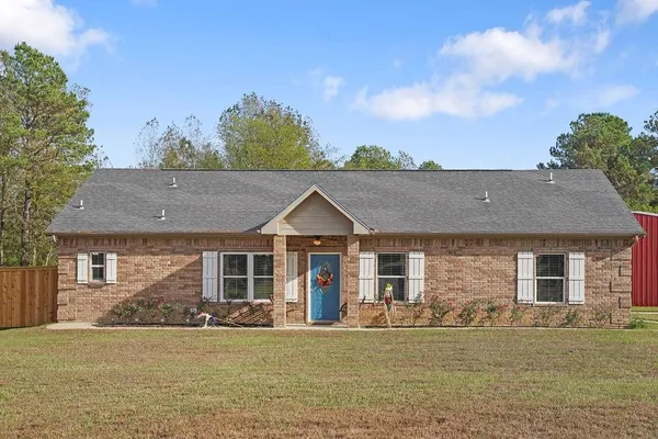 front view of a house with a garden
