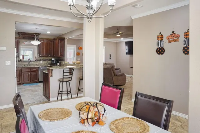 a living room with furniture and a kitchen