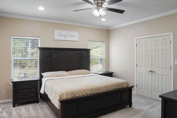 a bedroom with a bed and a window