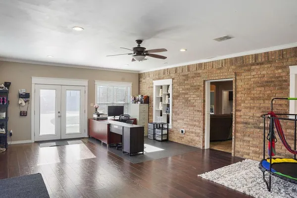 a view of a livingroom with furniture and a flat screen tv