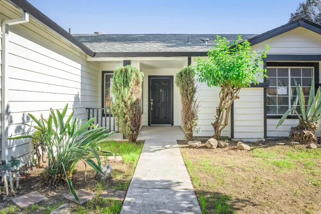 a front view of a house having yard