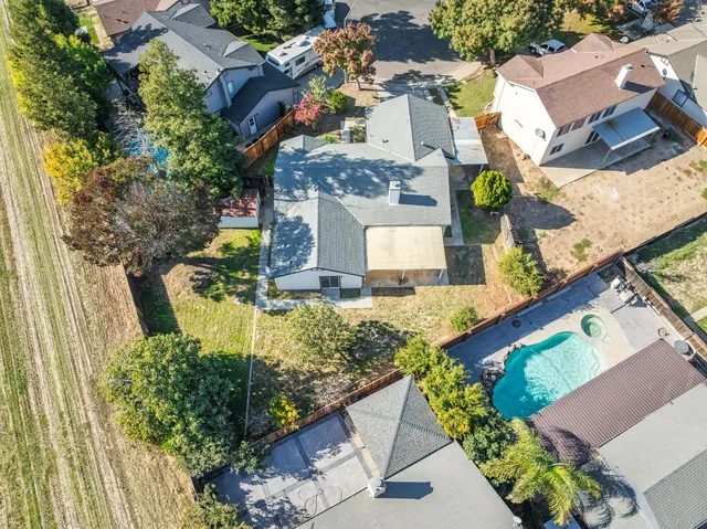 an aerial view of residential house with outdoor space