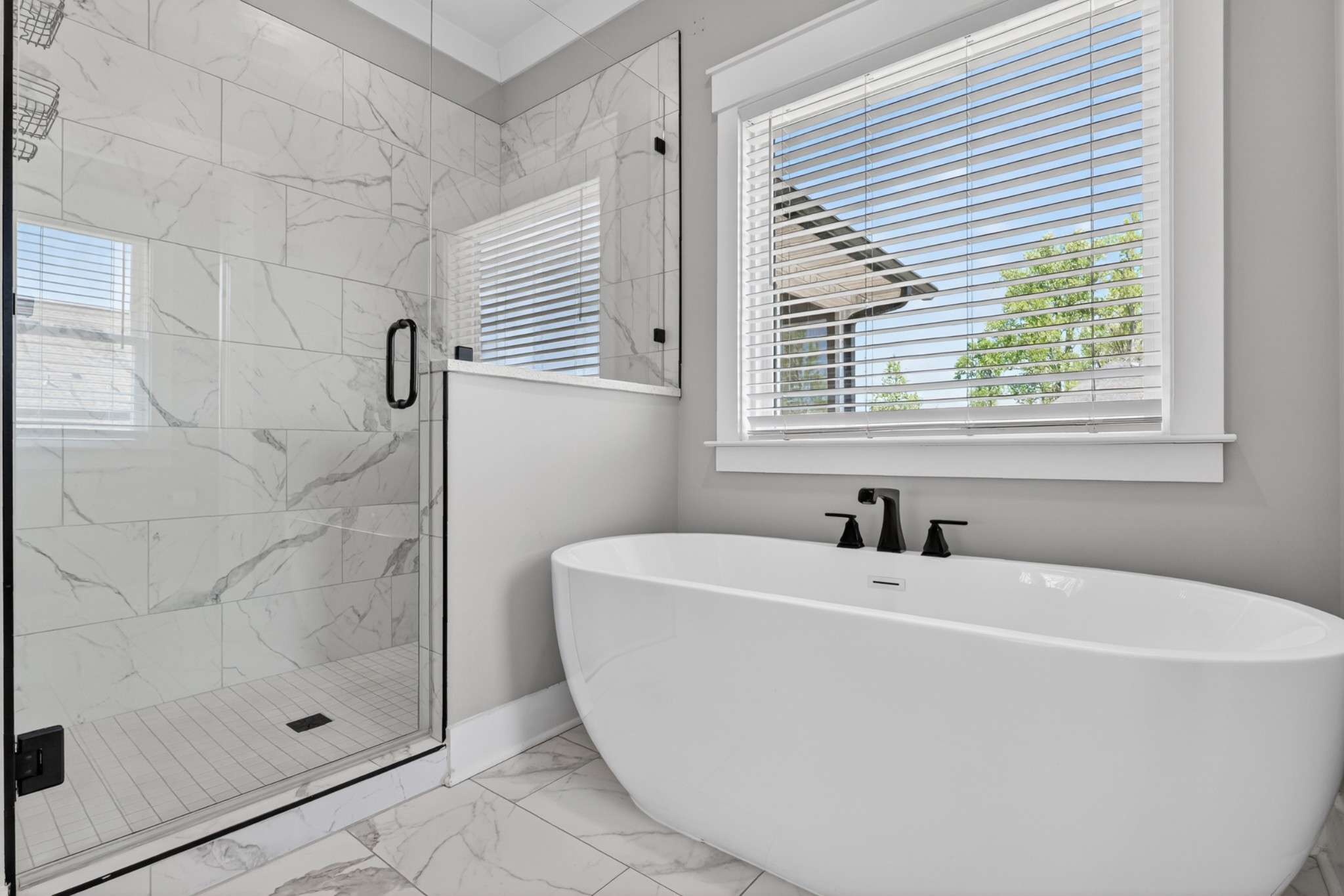 27 Hancock Road Fayetteville, TN 37334 - Photo 31 of 62 a white bath tub sitting in a bathroom next to a window