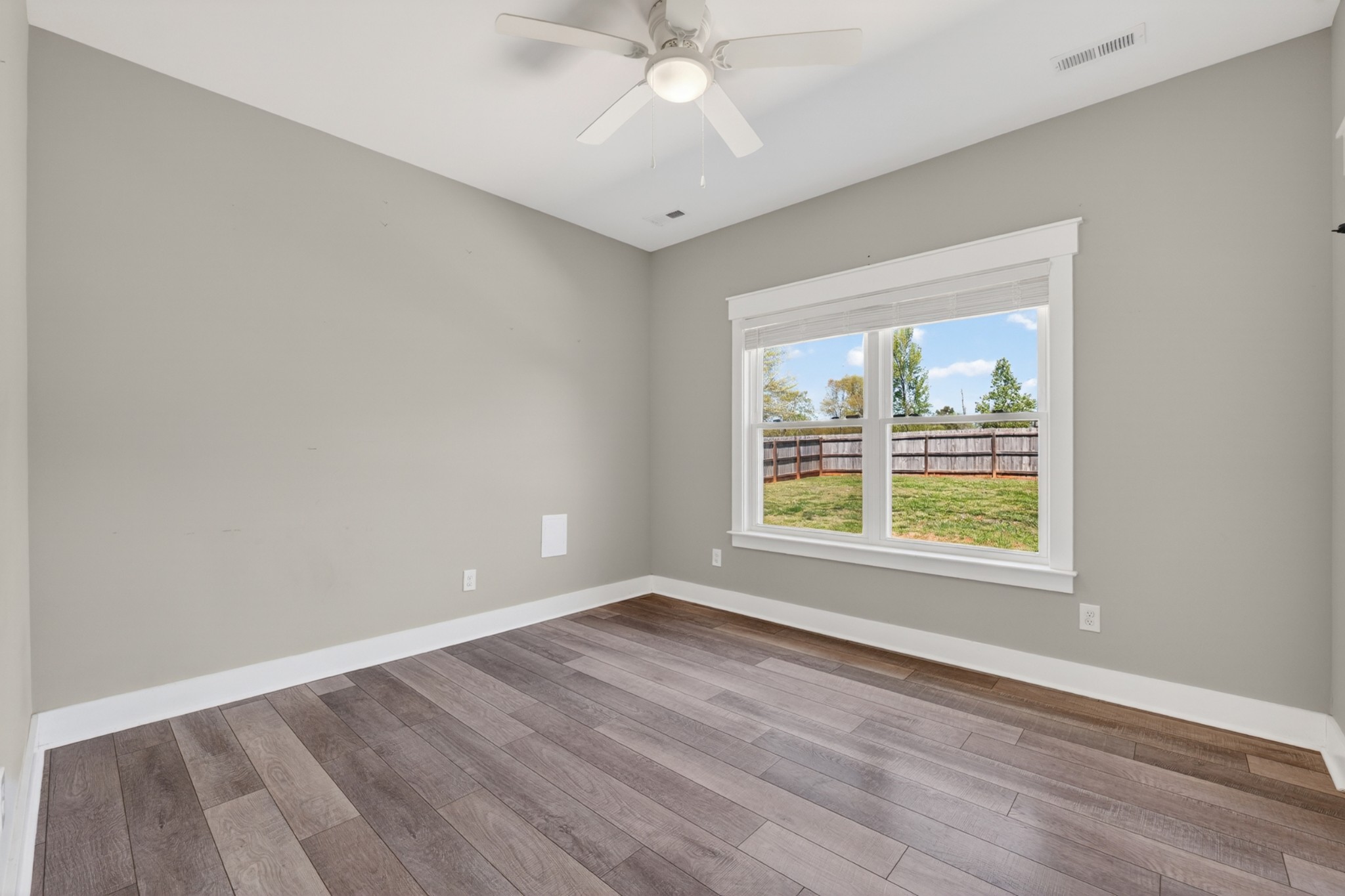 27 Hancock Road Fayetteville, TN 37334 - Photo 36 of 62 an empty room with wooden floor and windows