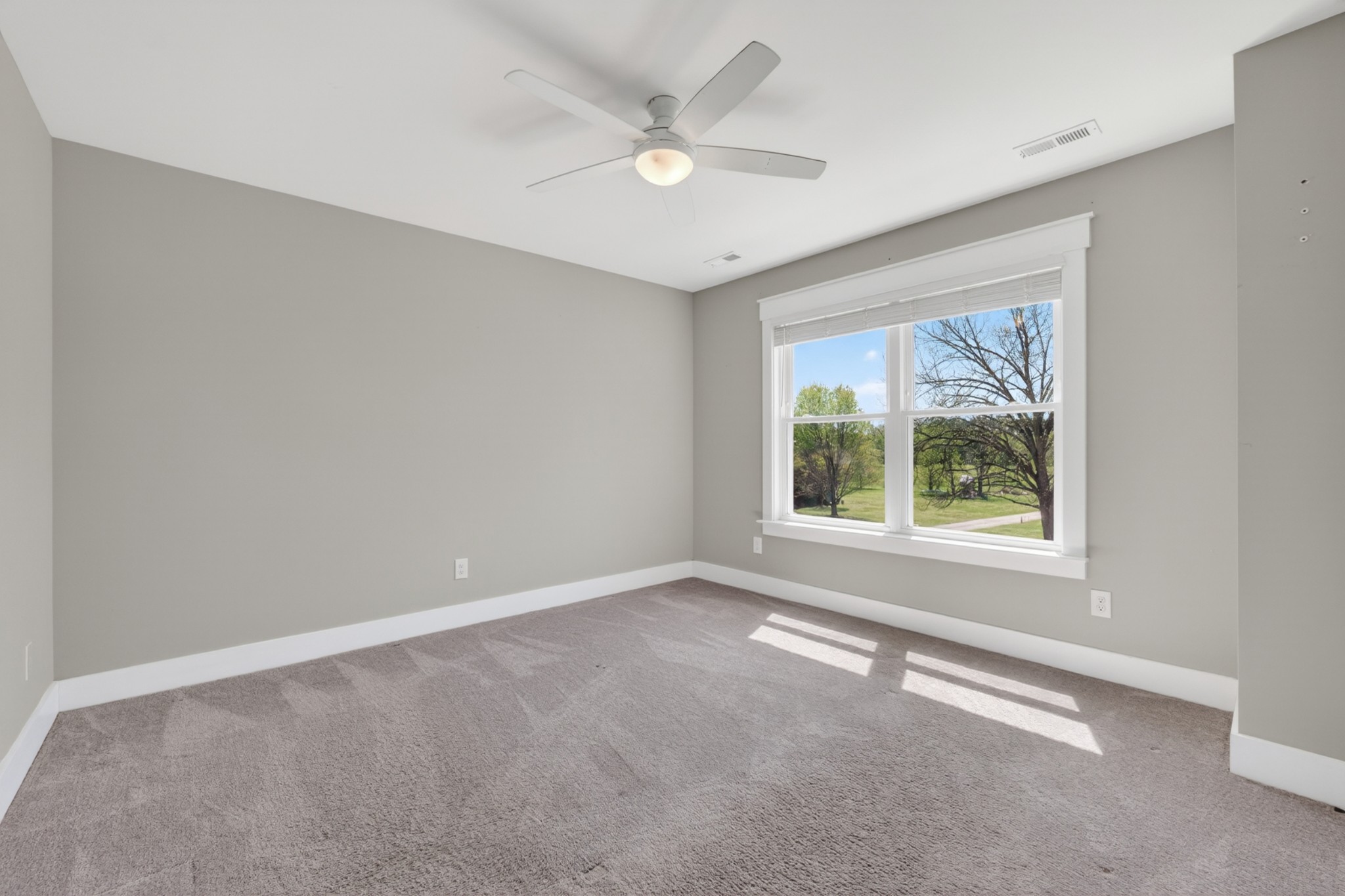 27 Hancock Road Fayetteville, TN 37334 - Photo 42 of 62 an empty room with a window and a ceiling fan