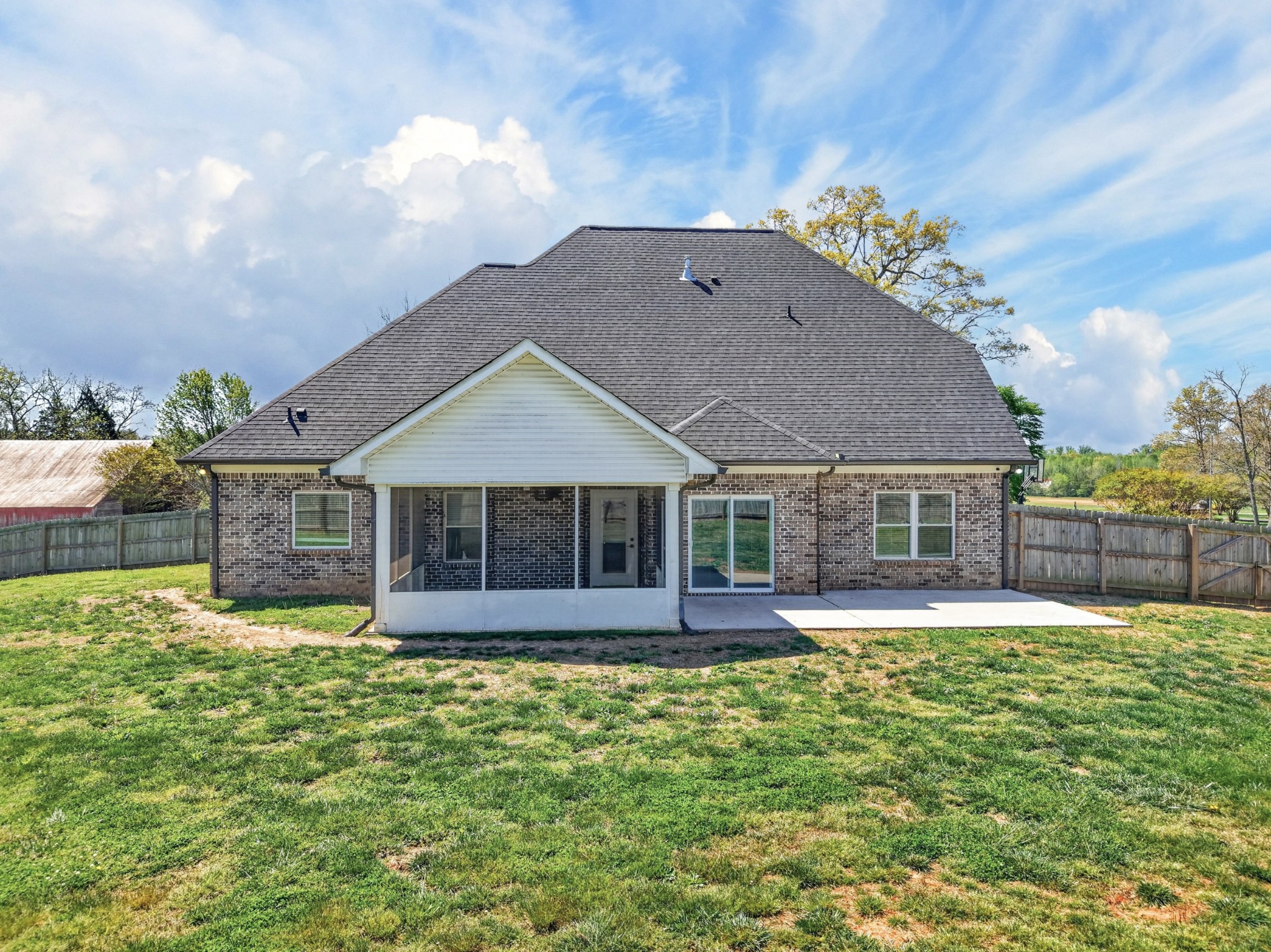 27 Hancock Road Fayetteville, TN 37334 - Photo 56 of 62 a front view of a house with a yard and potted plants