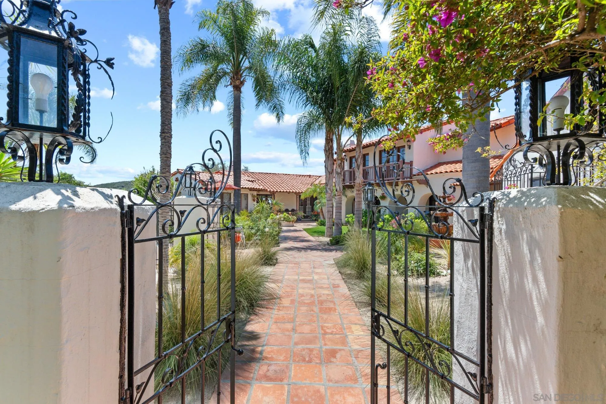 17156 Dos Hermanos Road Poway, CA 92064 - Photo 11 of 59 a view of a pathway of a house with a fountain in a yard