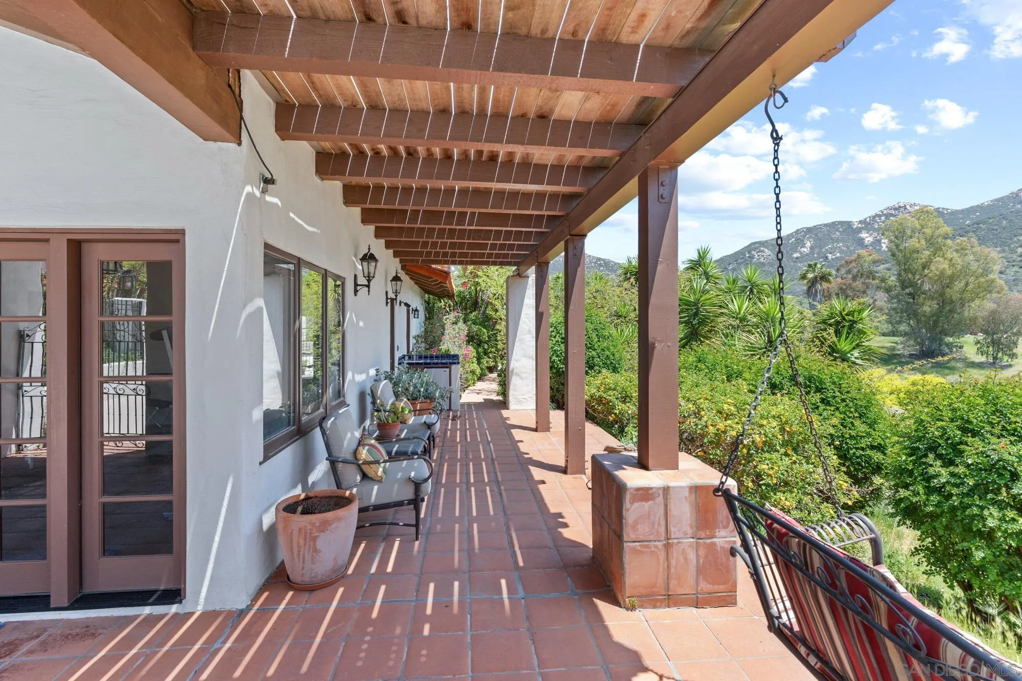 17156 Dos Hermanos Road Poway, CA 92064 - Photo 17 of 59 a view of balcony with chairs and wooden fence