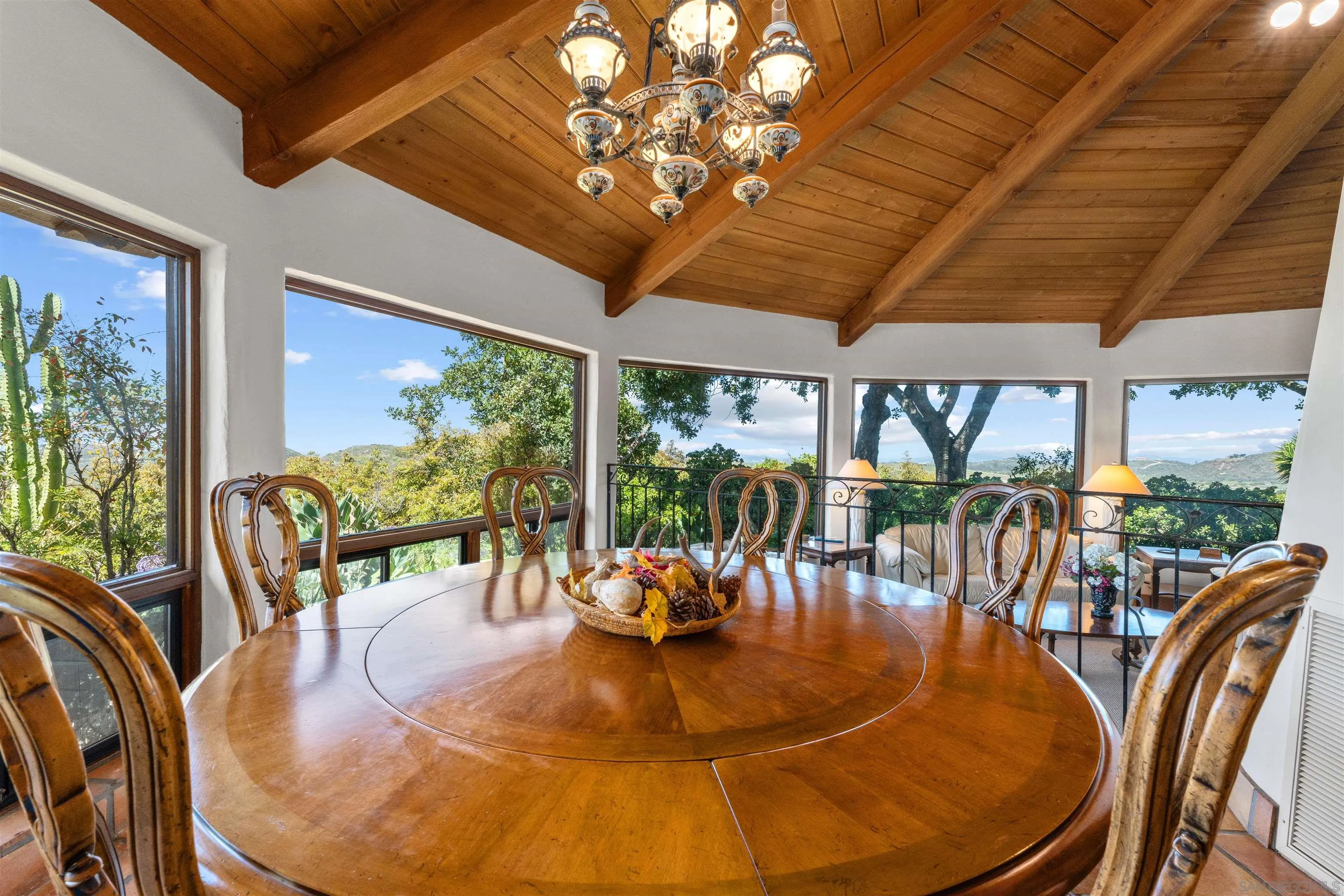 17156 Dos Hermanos Road Poway, CA 92064 - Photo 24 of 59 a view of a dining room with furniture wooden floor and chandelier