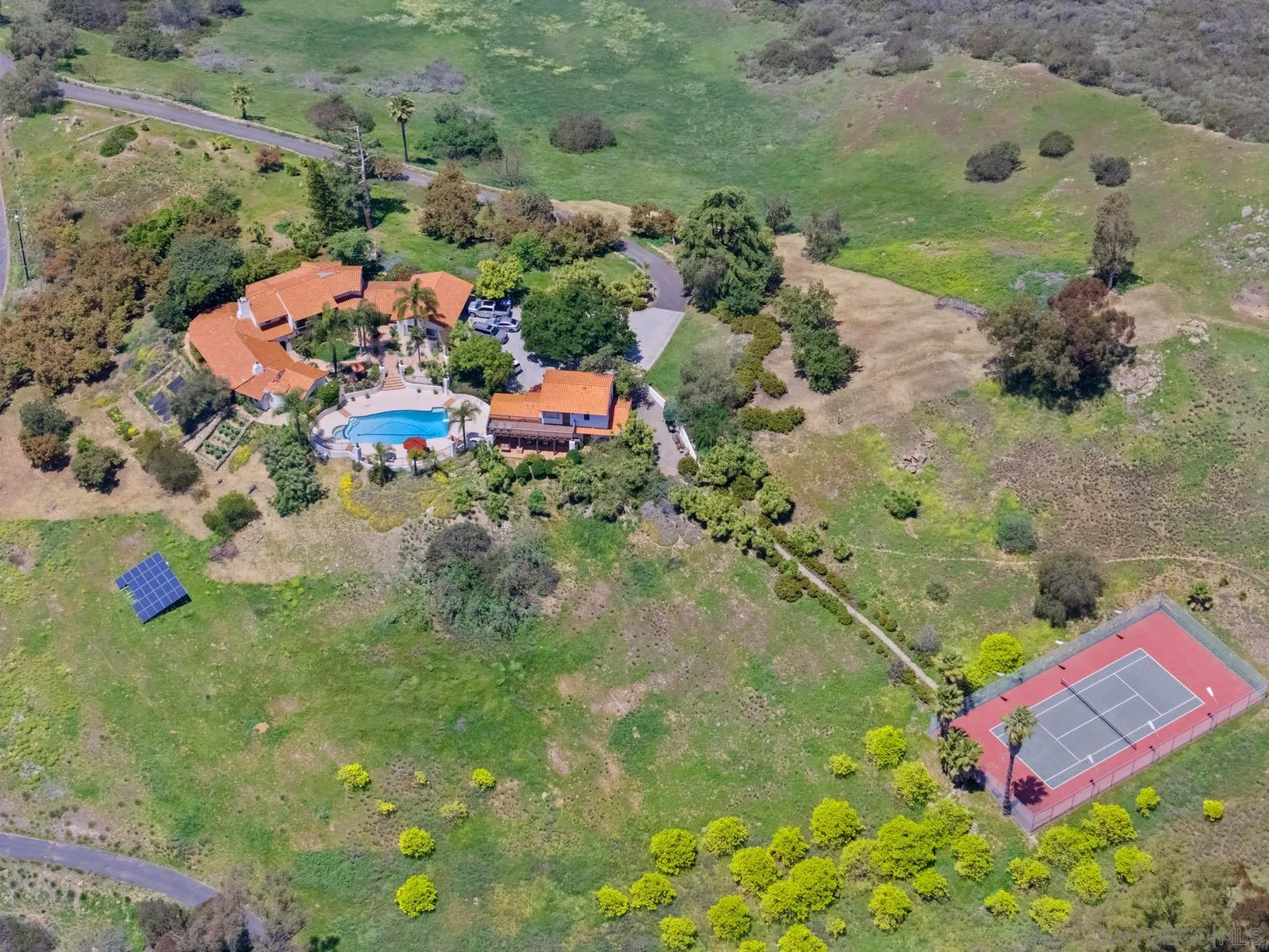 17156 Dos Hermanos Road Poway, CA 92064 - Photo 4 of 59 an aerial view of a house with a yard