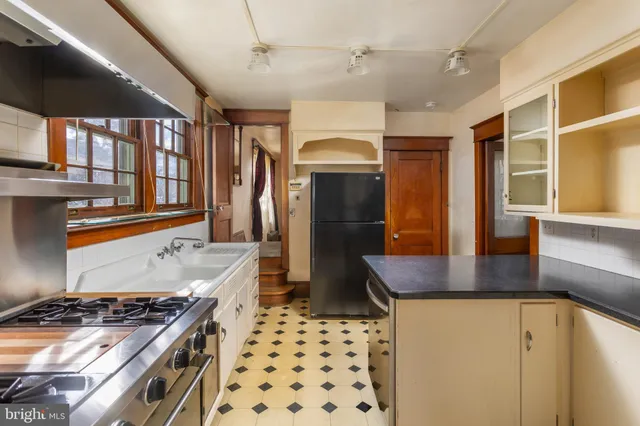 a bedroom with a large bed and a large window