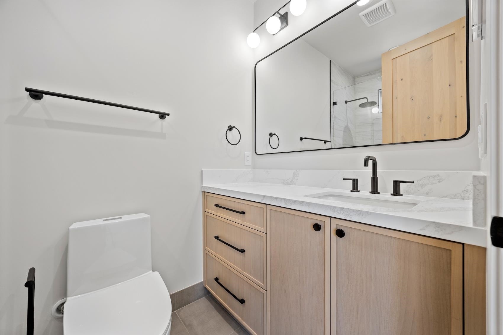 7350 Cascade Road Soda Springs, CA 95728 - Photo 16 of 27 a bathroom with a toilet sink double vanity and mirror