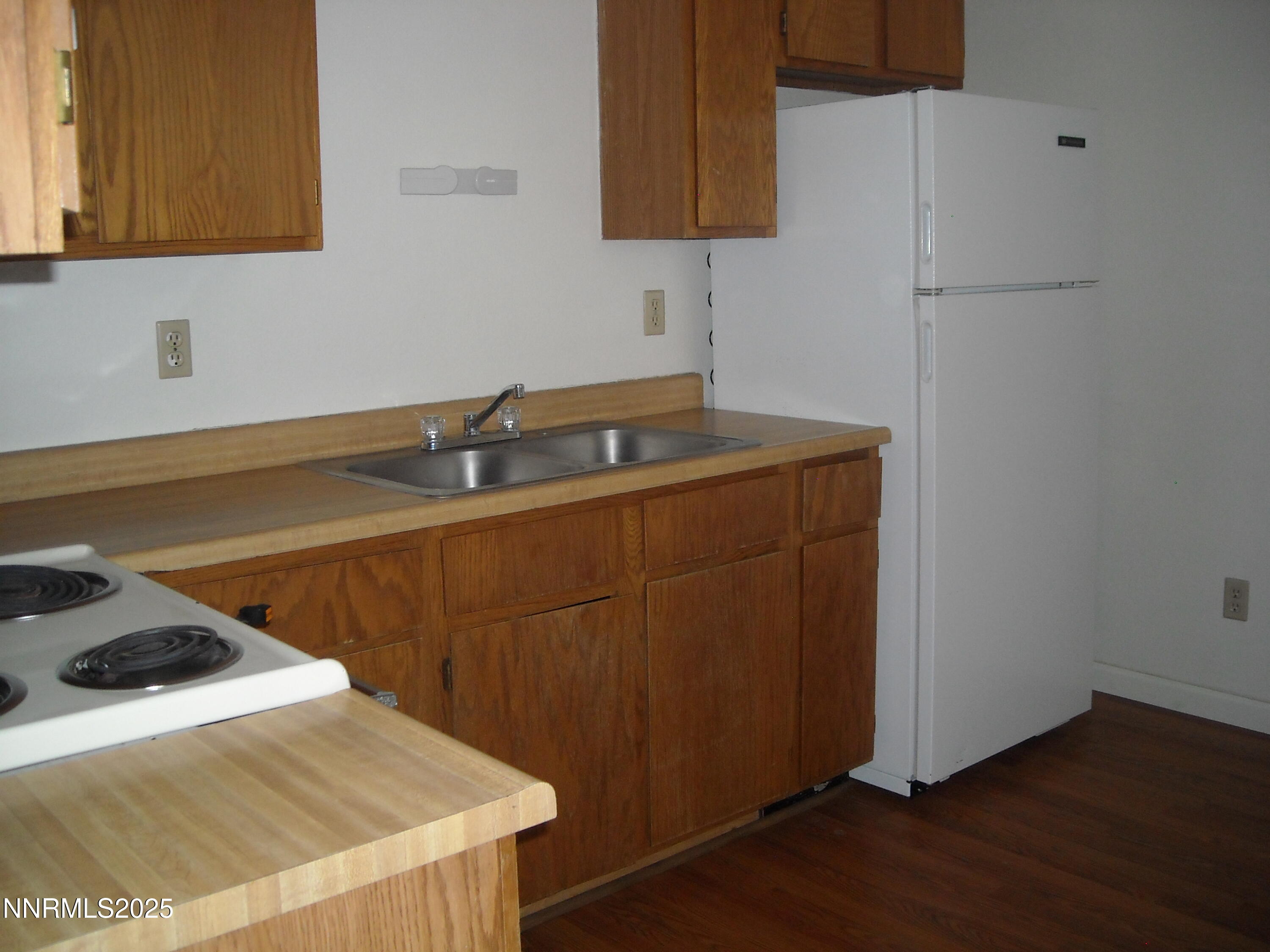 62 North Laverne Street Fallon, NV 89406 - Photo 3 of 6 a kitchen with a sink a stove and cabinets