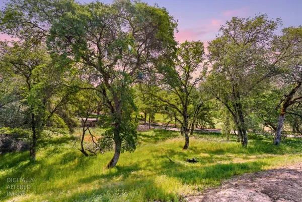 a backyard of a house with a yard and outdoor seating