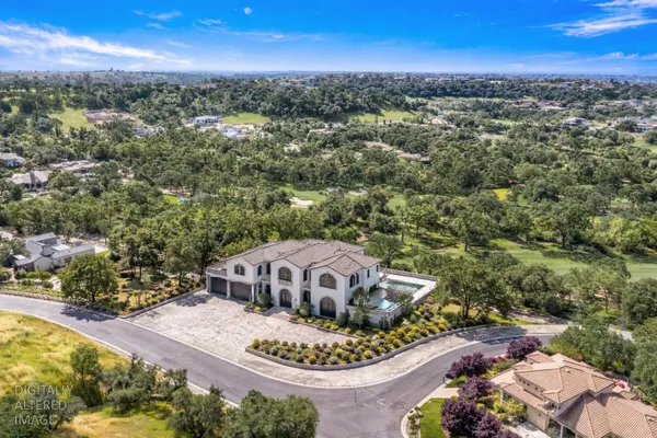 an aerial view of a house with a garden