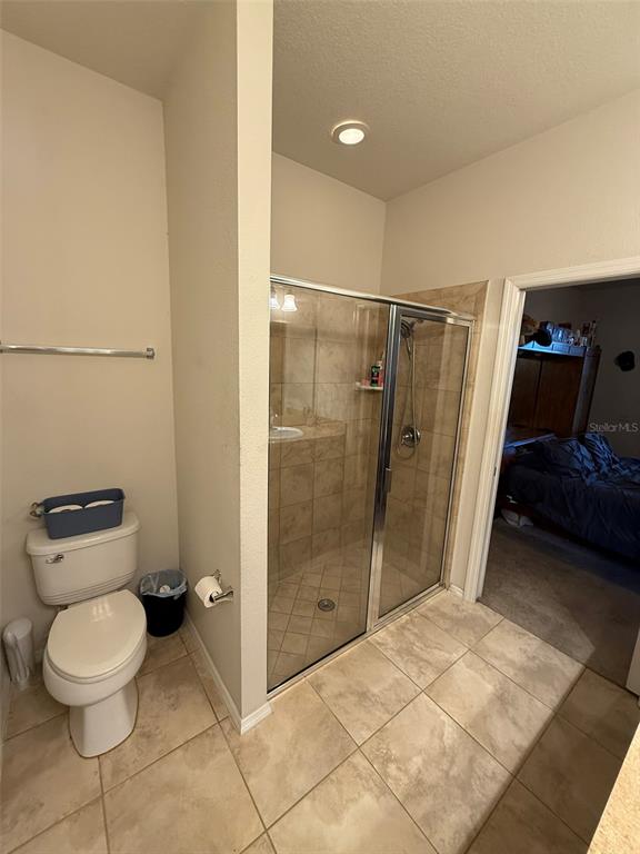 21846 Belgian Court Mount Dora, FL 32757 - Photo 16 of 29 a bathroom with a toilet and a shower