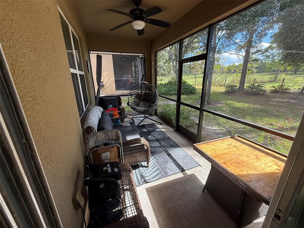 21846 Belgian Court Mount Dora, FL 32757 - Photo 23 of 29 a view of a living room with a floor to ceiling window
