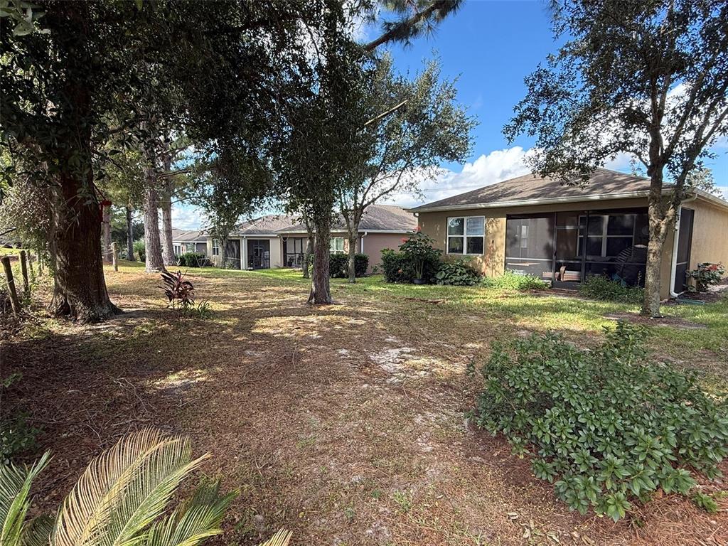 21846 Belgian Court Mount Dora, FL 32757 - Photo 26 of 29 a front view of a house with a yard