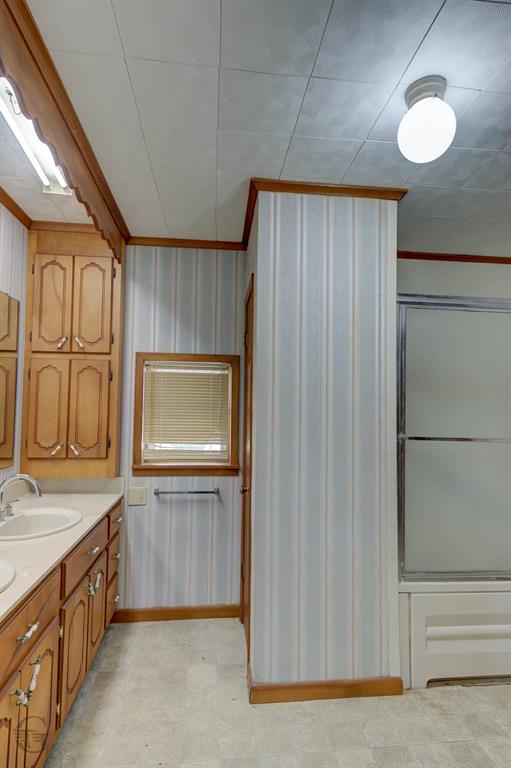 314 Dilly Road Mooringsport, LA 71060 - Photo 19 of 37 Tub/shower combo has grab bars. The bathroom also has a medicine cabinet and roomy linen closet