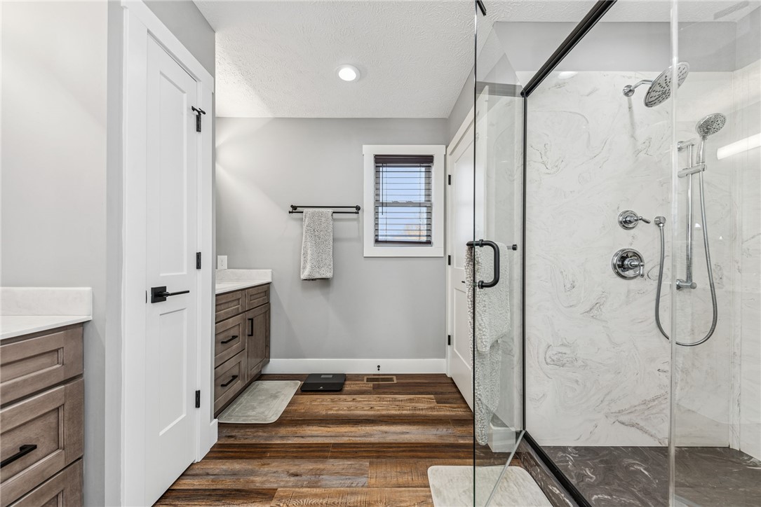 1602 Westboro Road Blanchester, OH 45107 - Photo 25 of 81 This modern bathroom features a spacious shower and sleek vanity, perfect for daily routines.