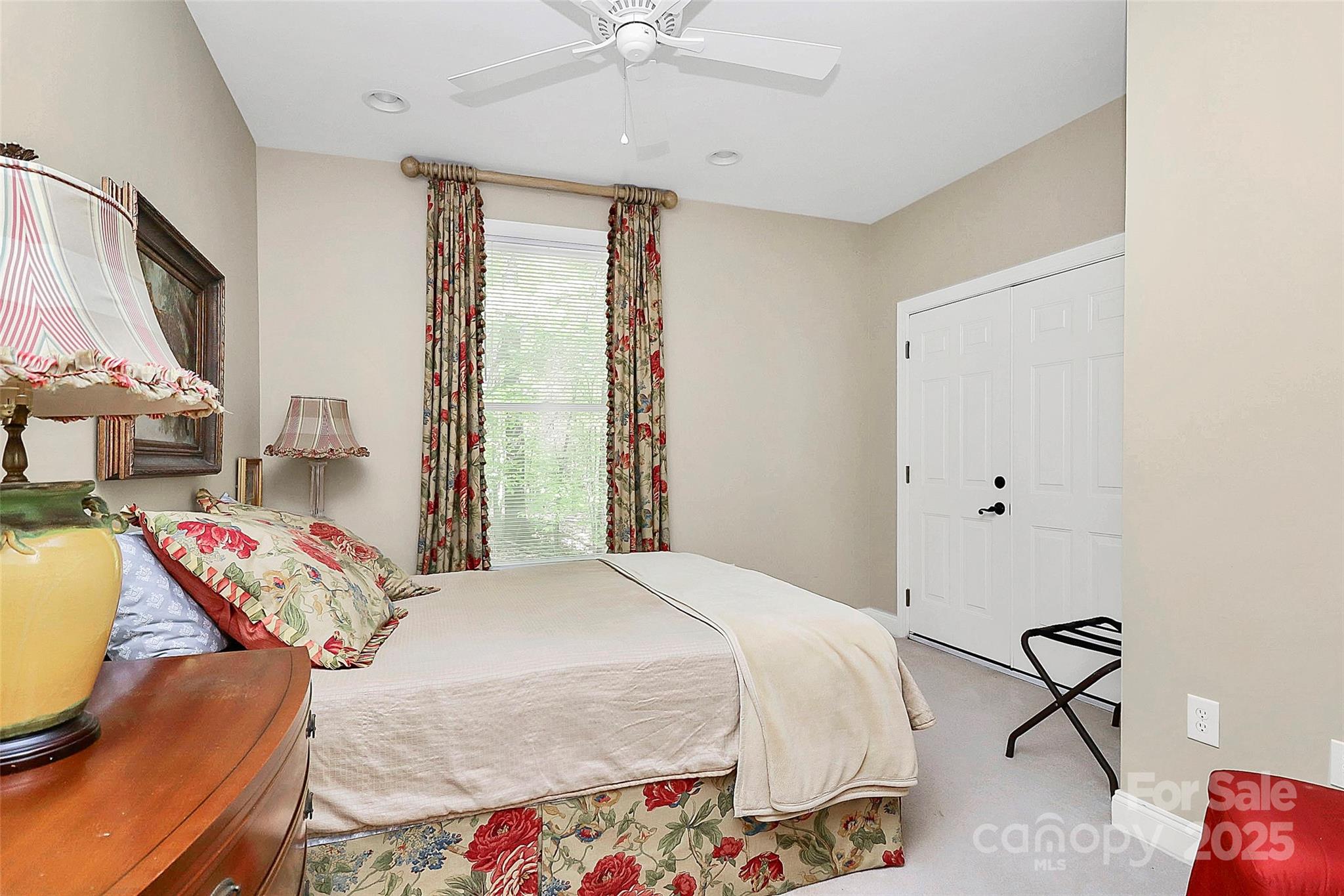729 Lochaven Road Waxhaw, NC 28173 - Photo 17 of 41 a bedroom with a bed and a chandelier