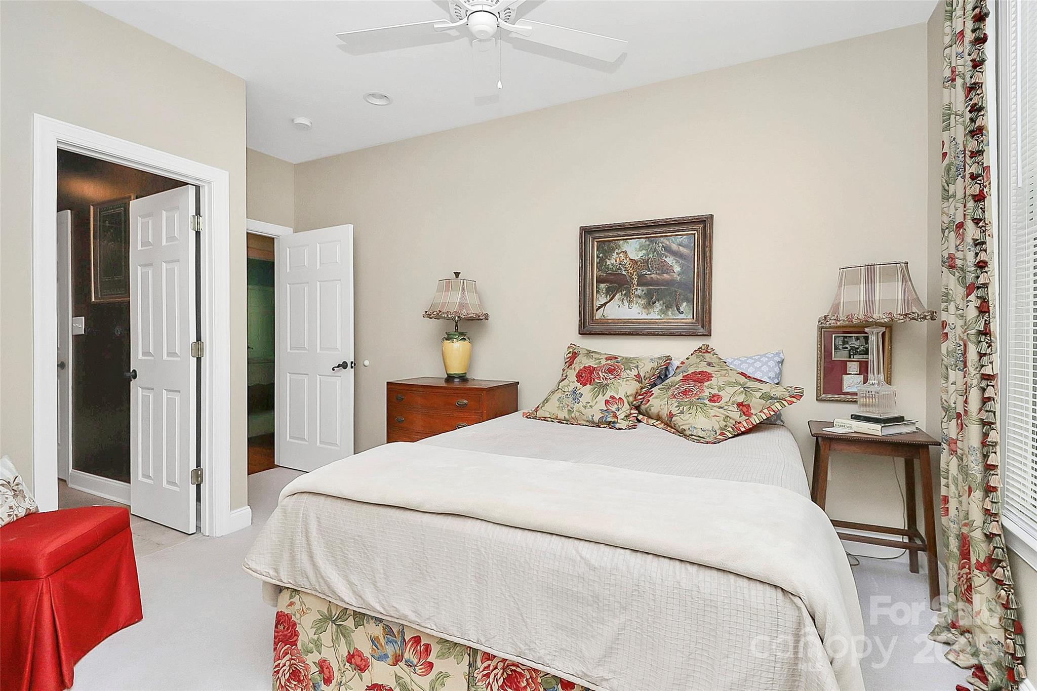 729 Lochaven Road Waxhaw, NC 28173 - Photo 19 of 41 a bedroom with bed and a chandelier