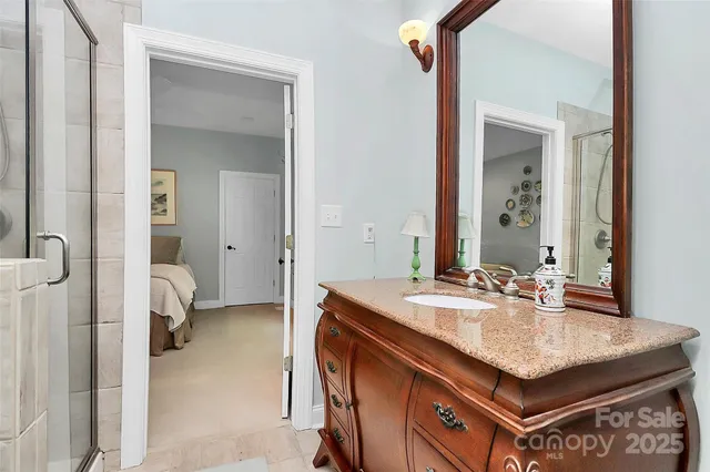 a white toilet sitting next to a shower