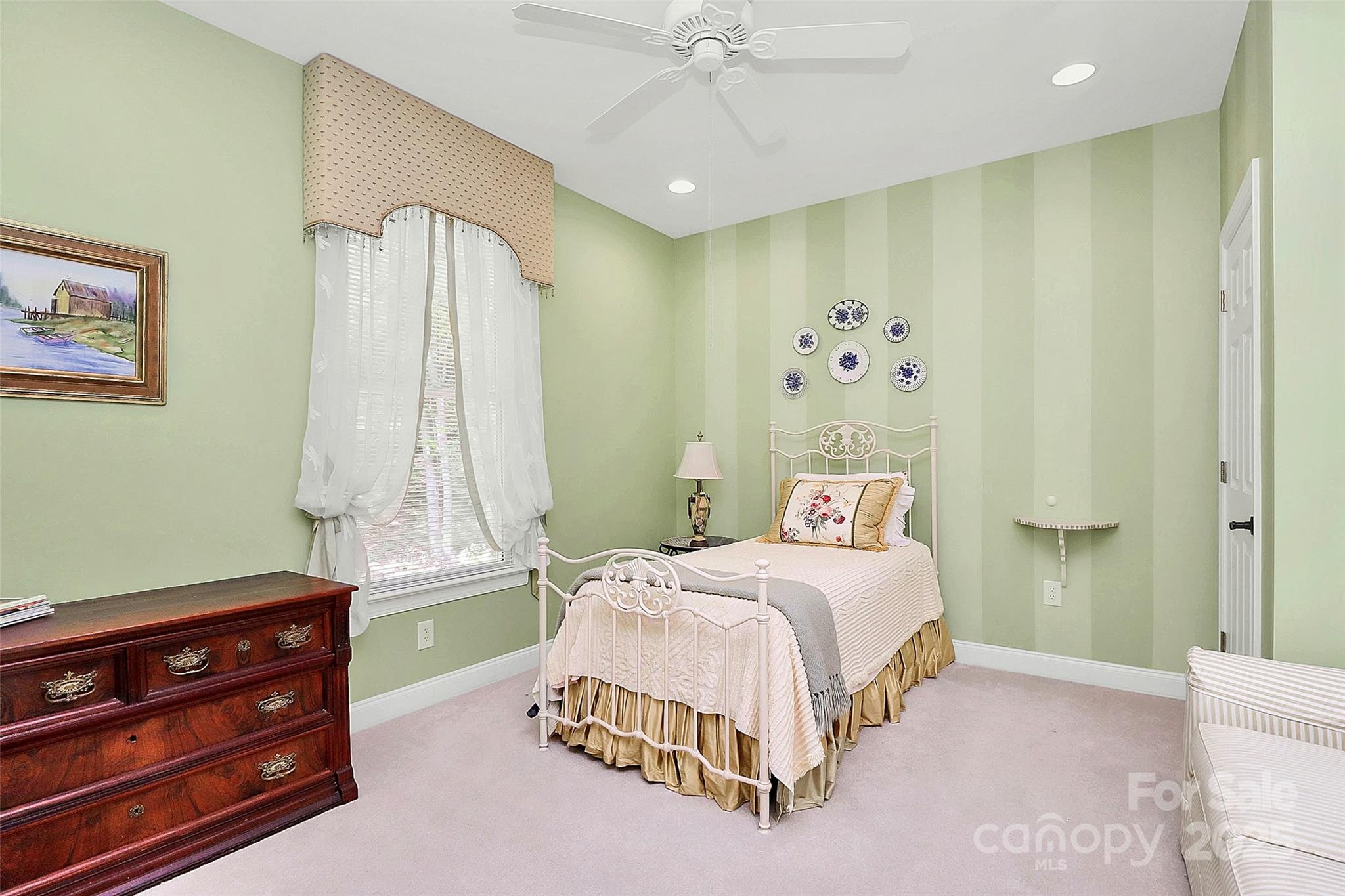 729 Lochaven Road Waxhaw, NC 28173 - Photo 22 of 41 a bedroom with a bed and a window