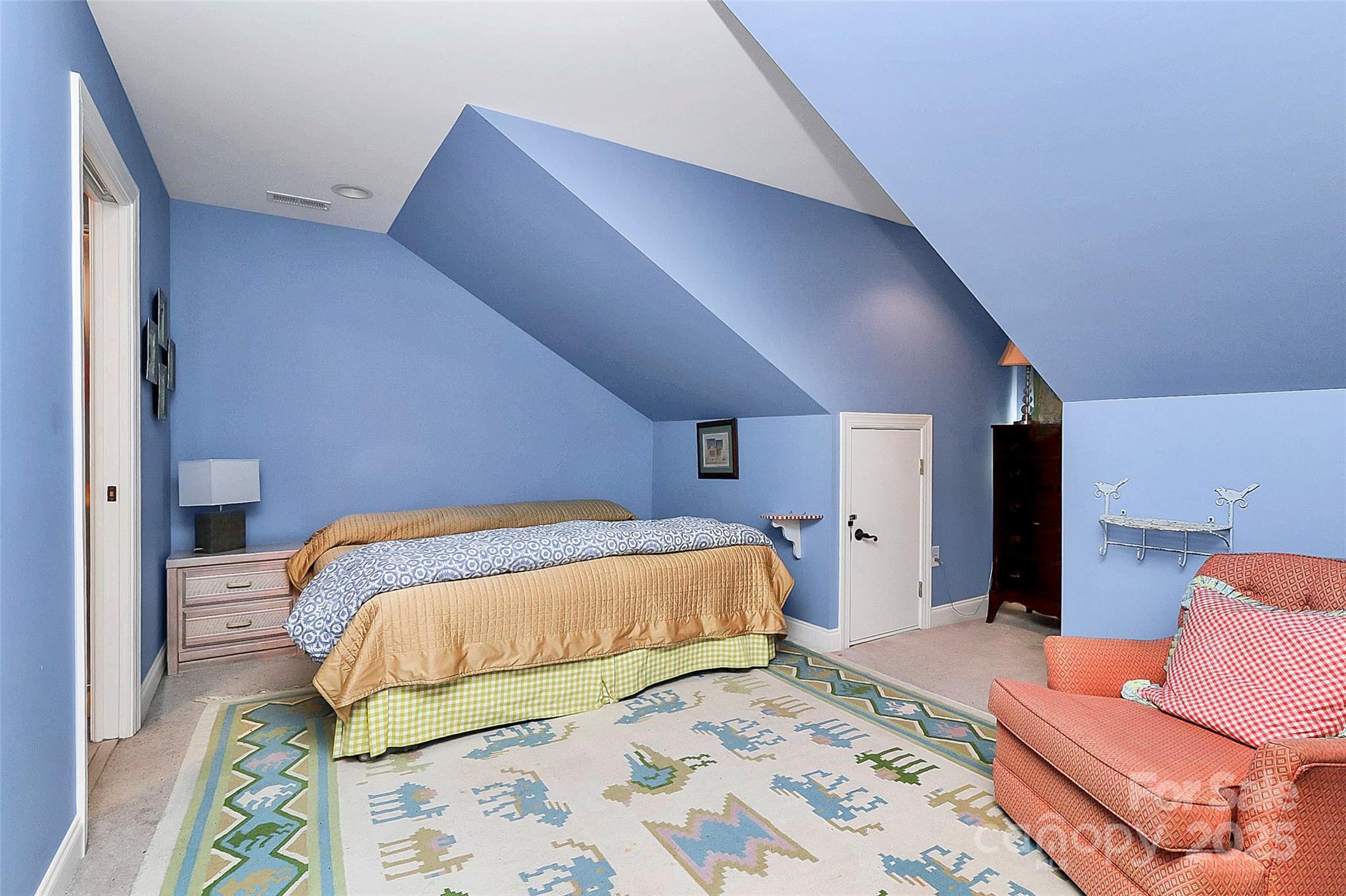 729 Lochaven Road Waxhaw, NC 28173 - Photo 28 of 41 a bedroom with a bed and chair