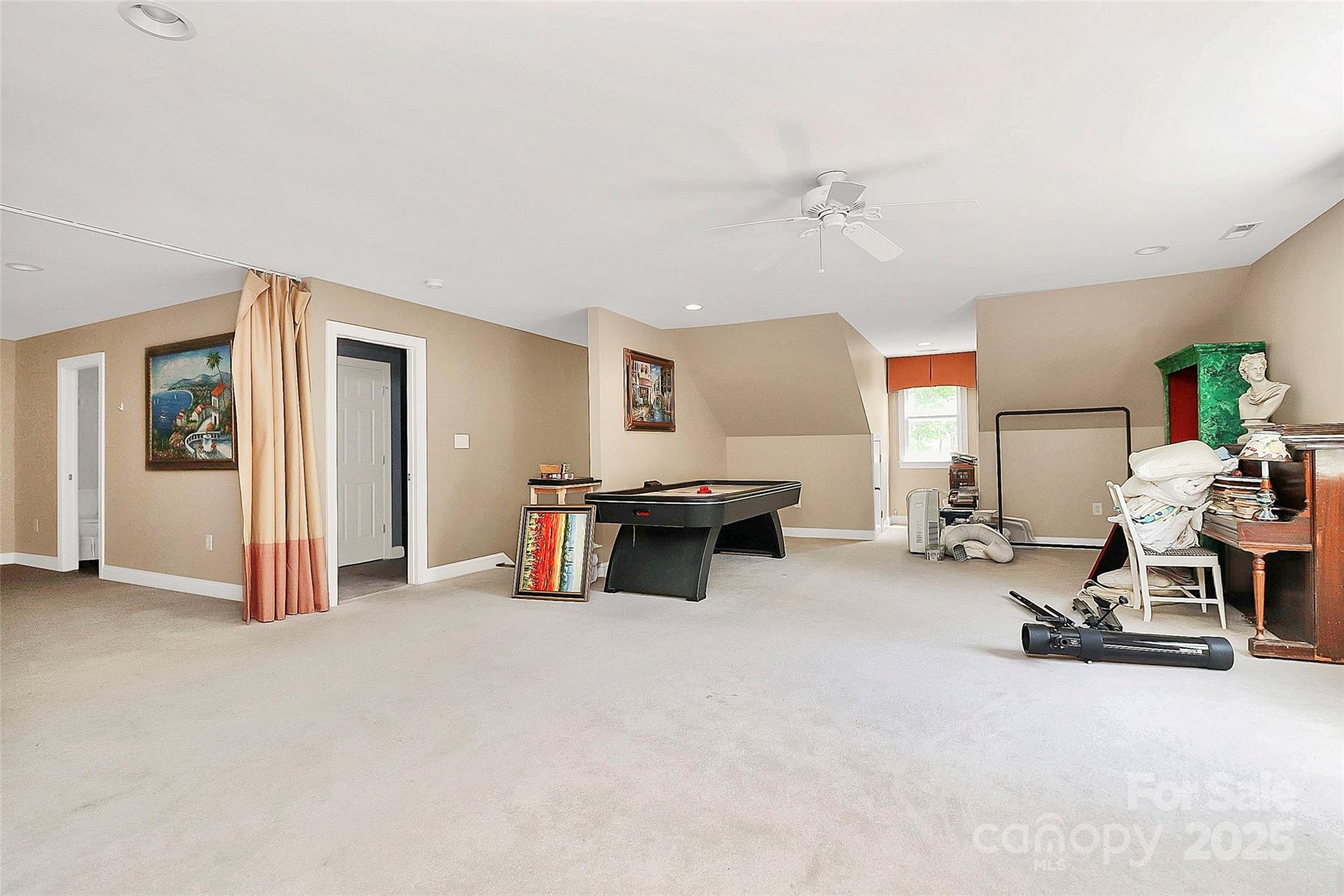 729 Lochaven Road Waxhaw, NC 28173 - Photo 32 of 41 a living room with furniture and a gym machine