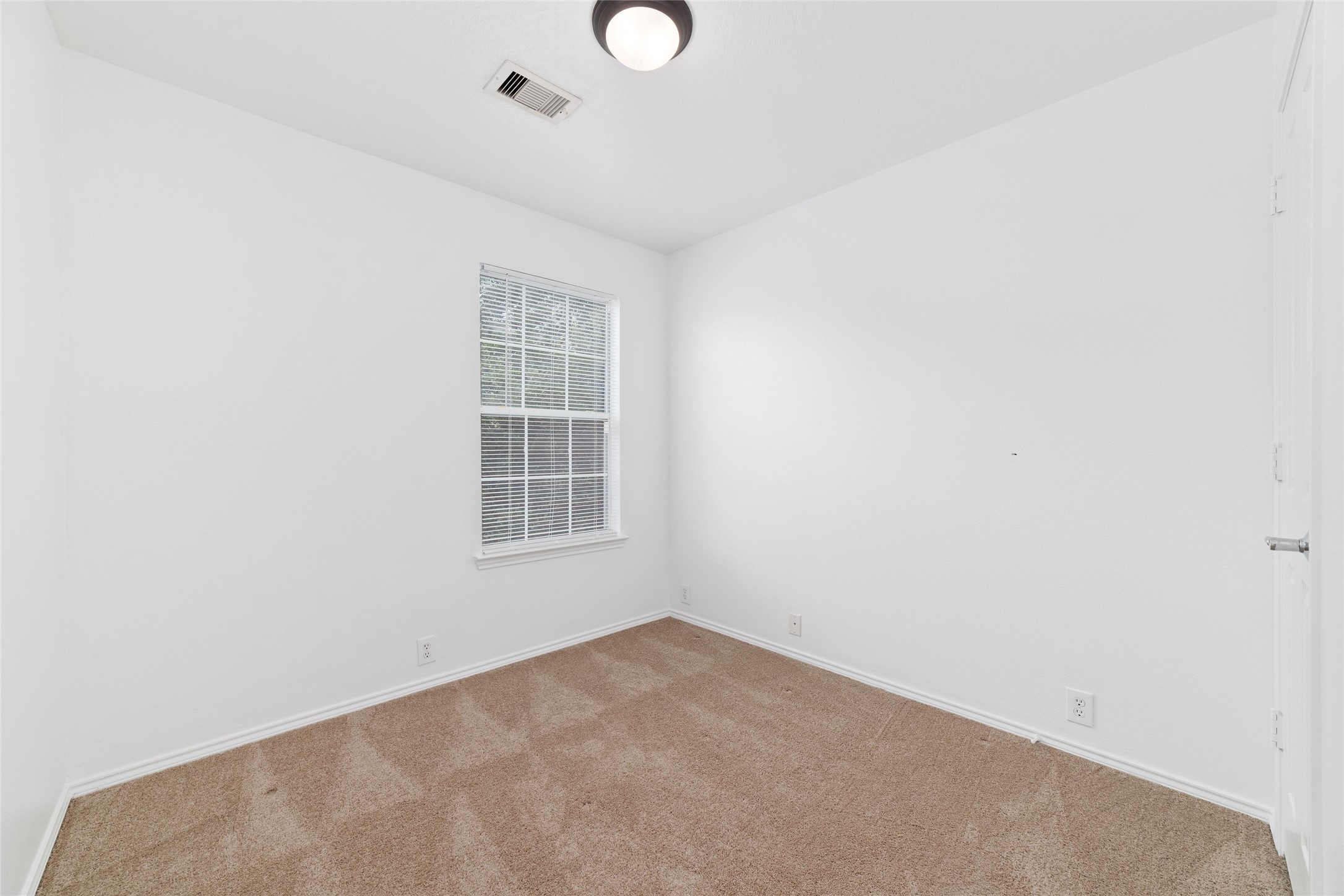 23602 Youpon Lake Lane Spring, TX 77373 - Photo 17 of 21 Bright secondary bedroom with window views and inviting feel.