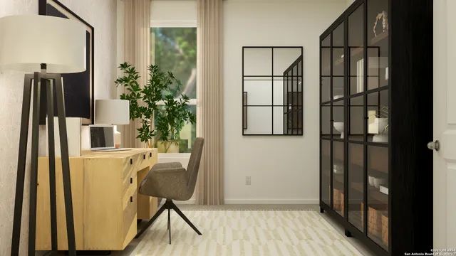 a view of a hallway with wooden floor and a bathroom