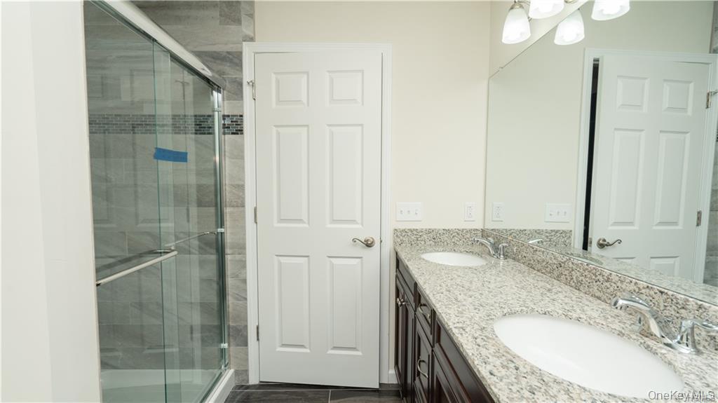 5 Harrier Ridge Drive Wallkill, NY 12589 - Photo 16 of 32 Full bathroom with double vanity and a shower stall