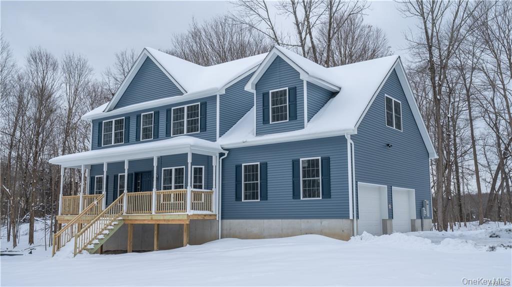 5 Harrier Ridge Drive Wallkill, NY 12589 - Photo 28 of 32 View of front of house featuring a garage, covered porch, and stairway