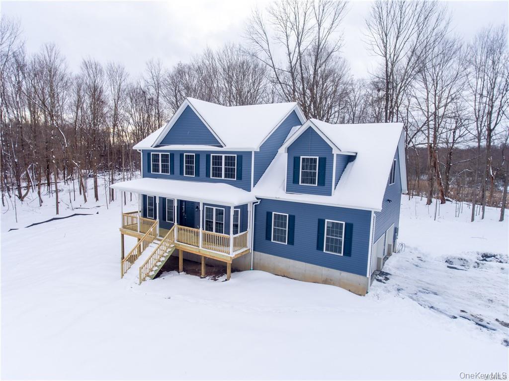 5 Harrier Ridge Drive Wallkill, NY 12589 - Photo 28 of 33 a view of a house with a yard covered in snow