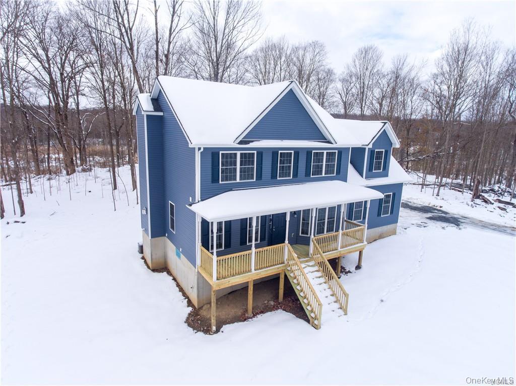 5 Harrier Ridge Drive Wallkill, NY 12589 - Photo 29 of 32 View of front of home with stairs and a porch