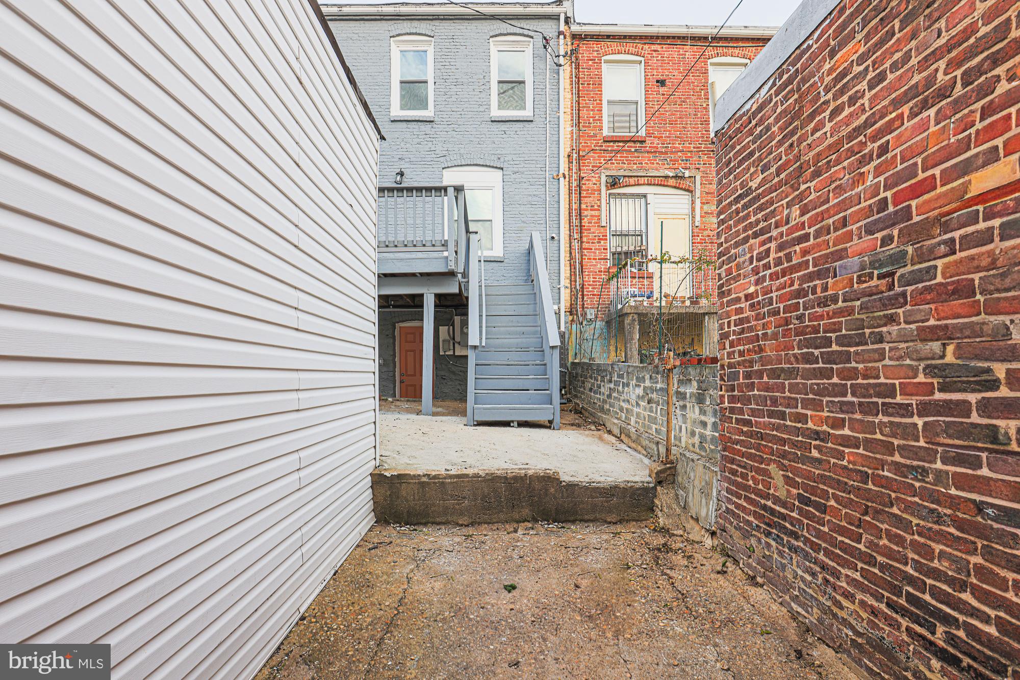 3611 Belair Road Baltimore, MD 21213 - Photo 13 of 60 a view of a brick house with a door and wooden floor