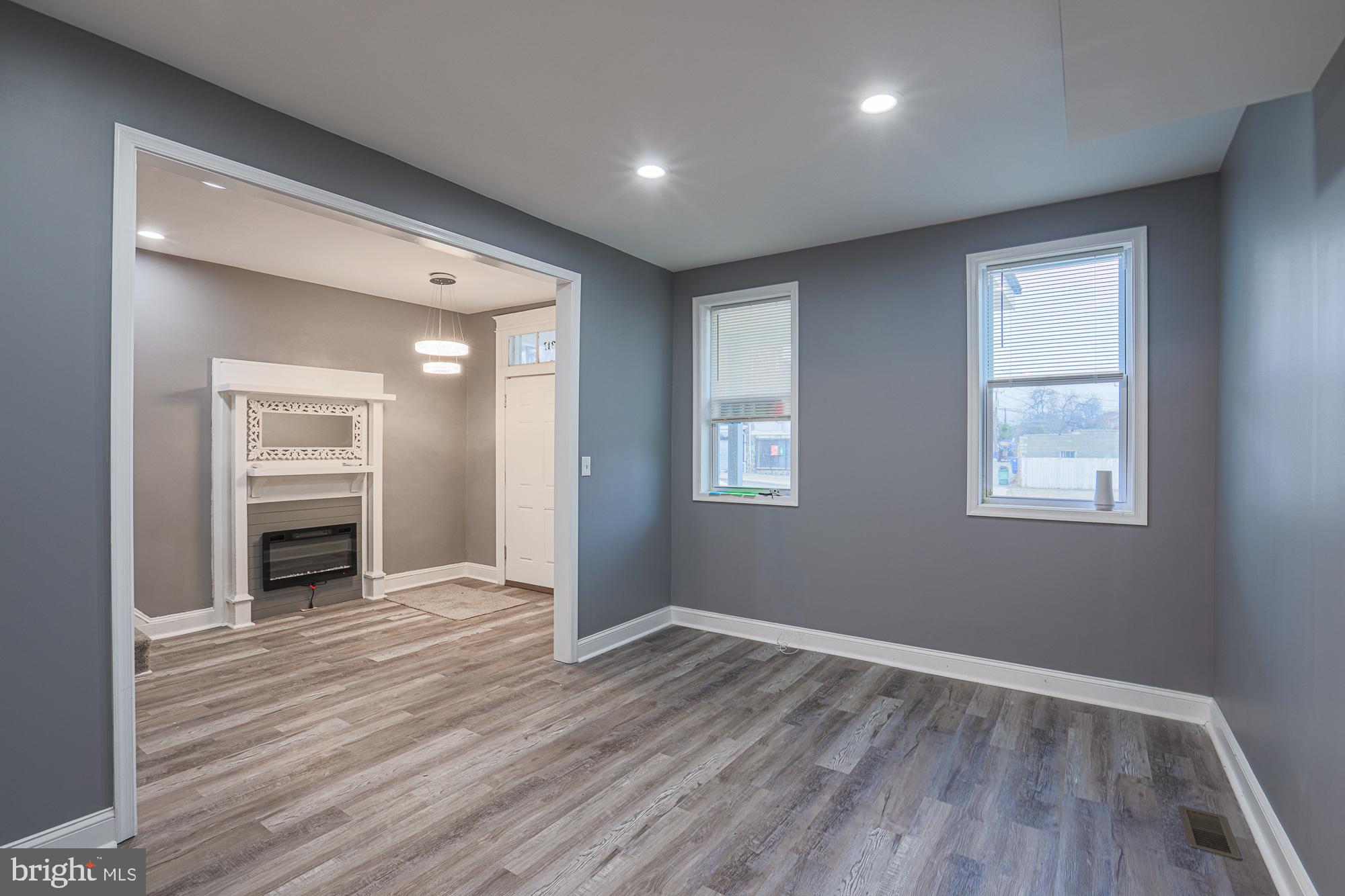 3611 Belair Road Baltimore, MD 21213 - Photo 22 of 60 wooden floor in an empty room with a window