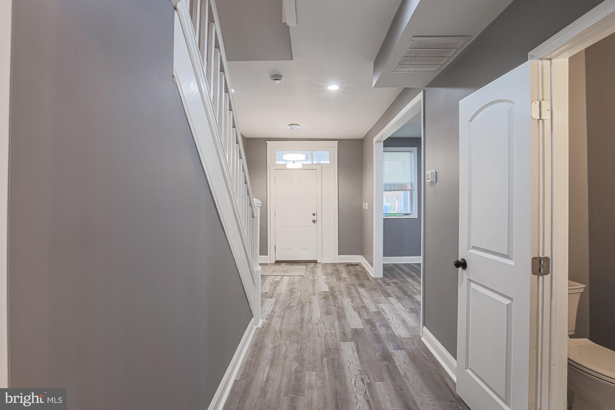 3611 Belair Road Baltimore, MD 21213 - Photo 34 of 60 a view of hallway with wooden floor
