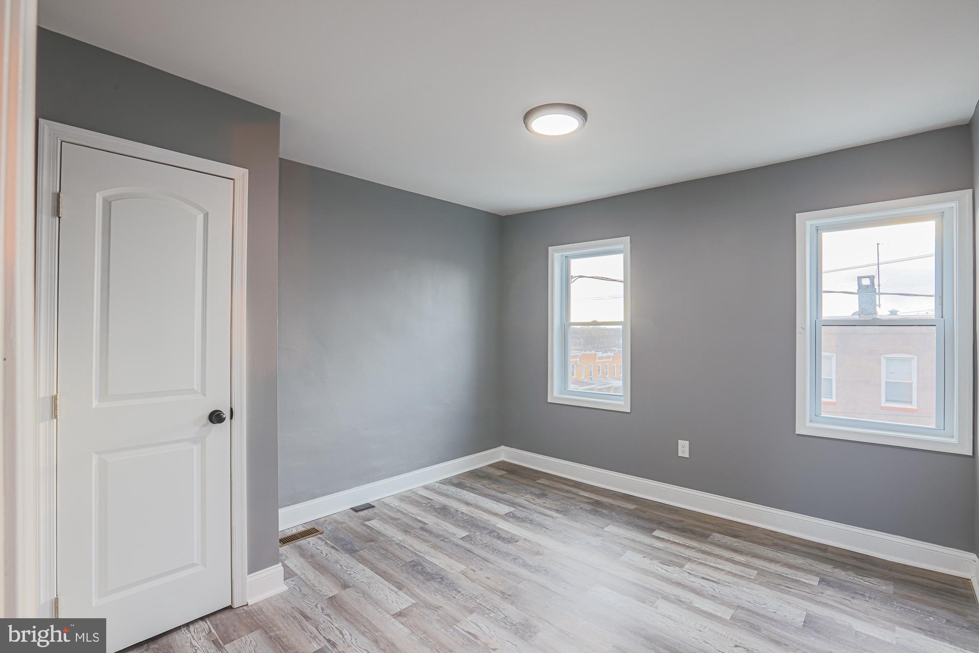 3611 Belair Road Baltimore, MD 21213 - Photo 45 of 60 an empty room with windows and closet