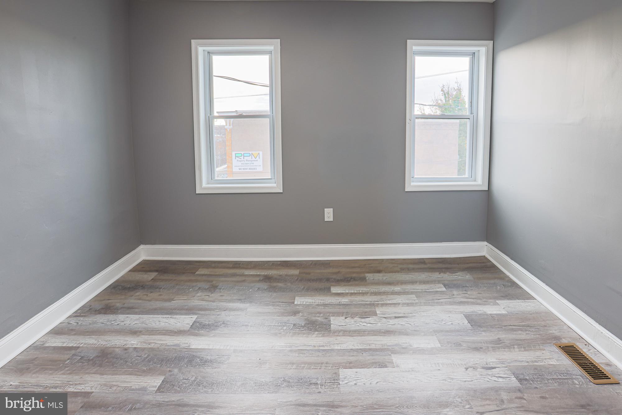 3611 Belair Road Baltimore, MD 21213 - Photo 46 of 60 a view of a room with wooden floor and window