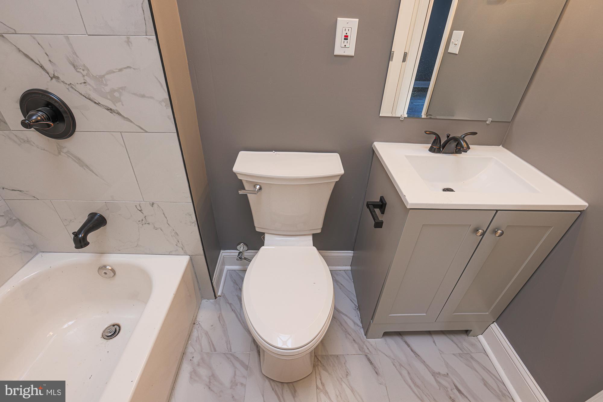 3611 Belair Road Baltimore, MD 21213 - Photo 50 of 60 a bathroom with a sink and toilet