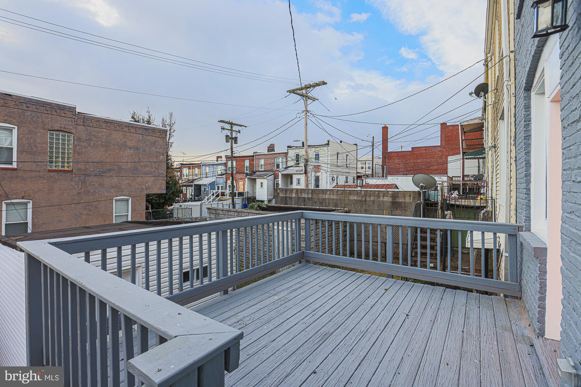 3611 Belair Road Baltimore, MD 21213 - Photo 8 of 60 a view of a balcony with wooden floor