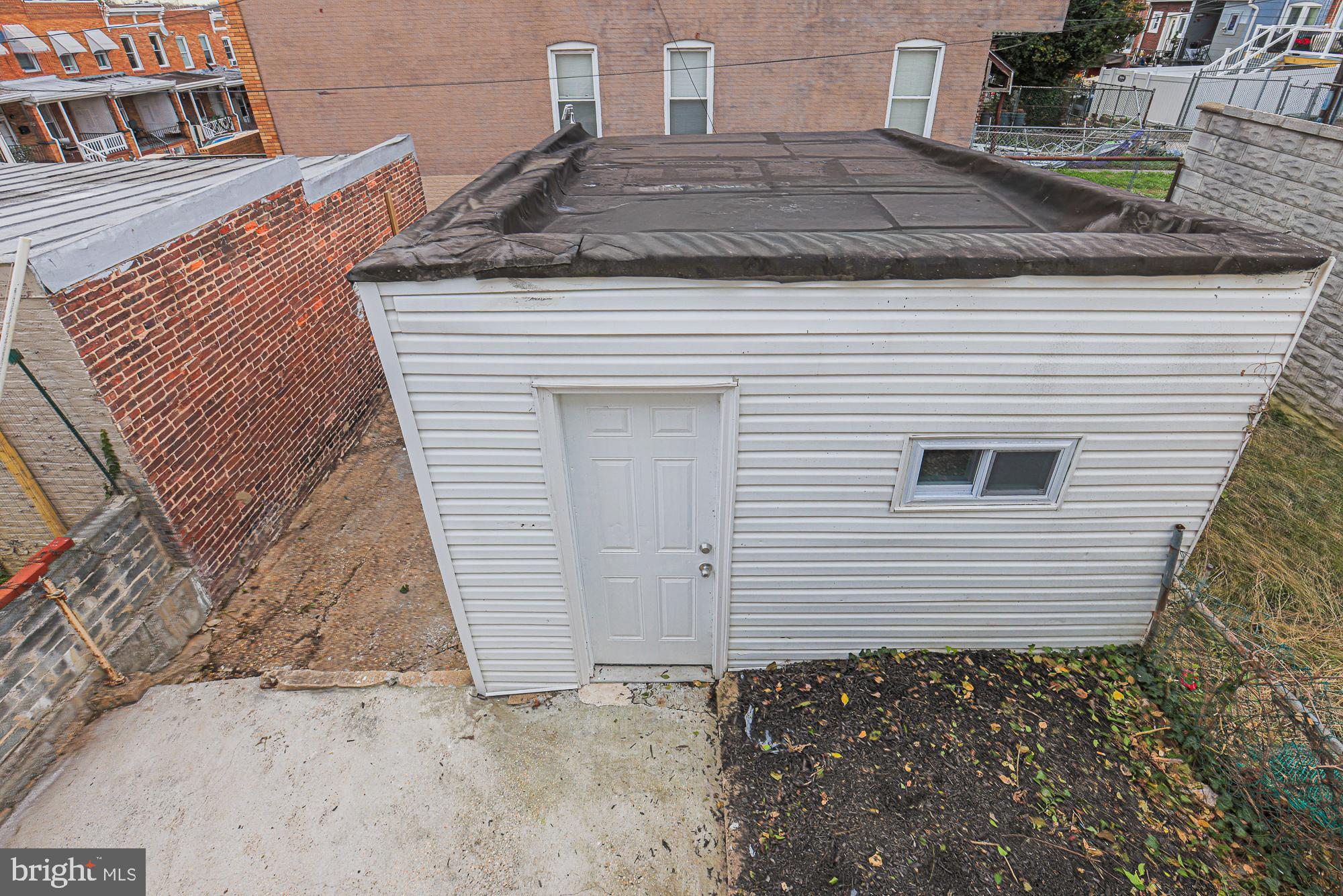 3611 Belair Road Baltimore, MD 21213 - Photo 9 of 60 a view of a house with a door