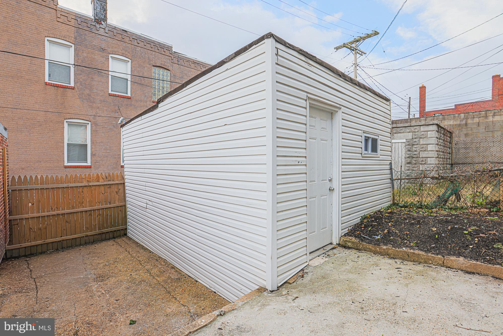 3611 Belair Road Baltimore, MD 21213 - Photo 10 of 60 a view of a house with a yard