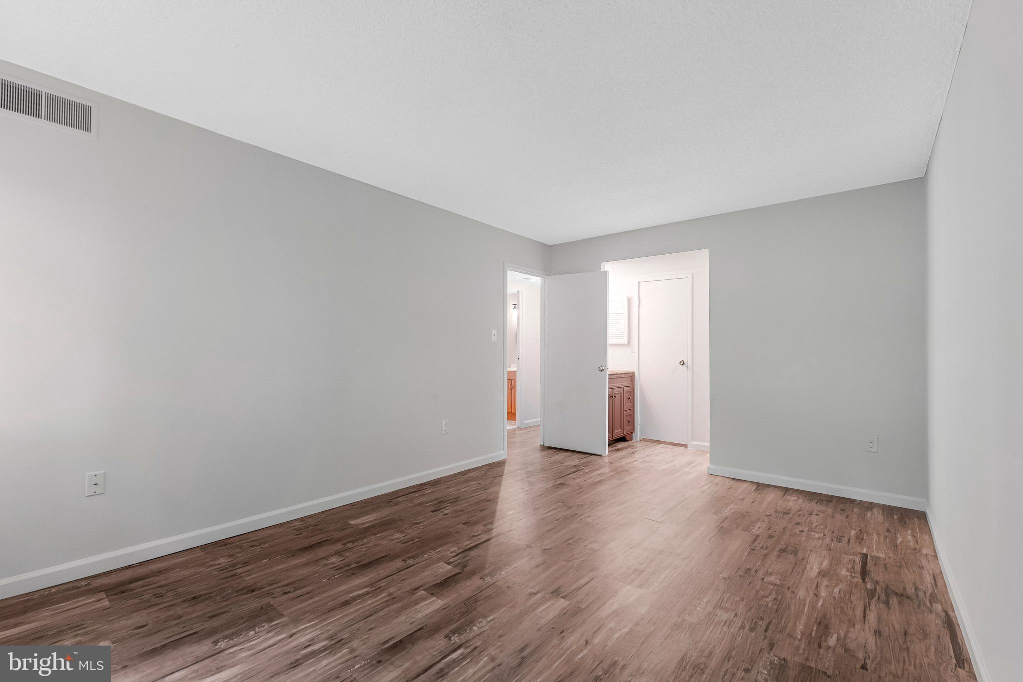 2210 Springwood Drive, Unit 107 Reston, VA 20191 - Photo 15 of 26 Primary Bedroom