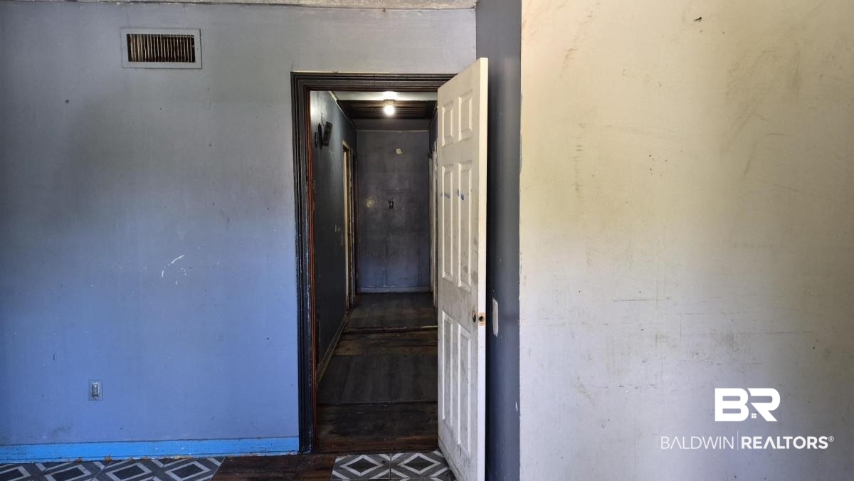 2207 Roberta Drive Mobile, AL 36617 - Photo 4 of 14 Hallway featuring baseboards