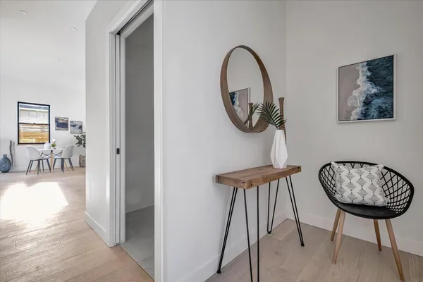 a view of a hallway with paintings on the wall