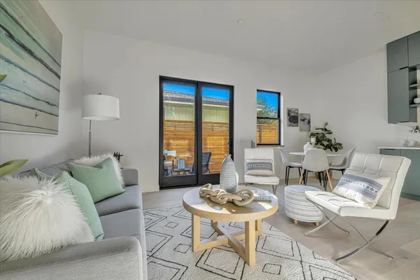 a living room with furniture and a table