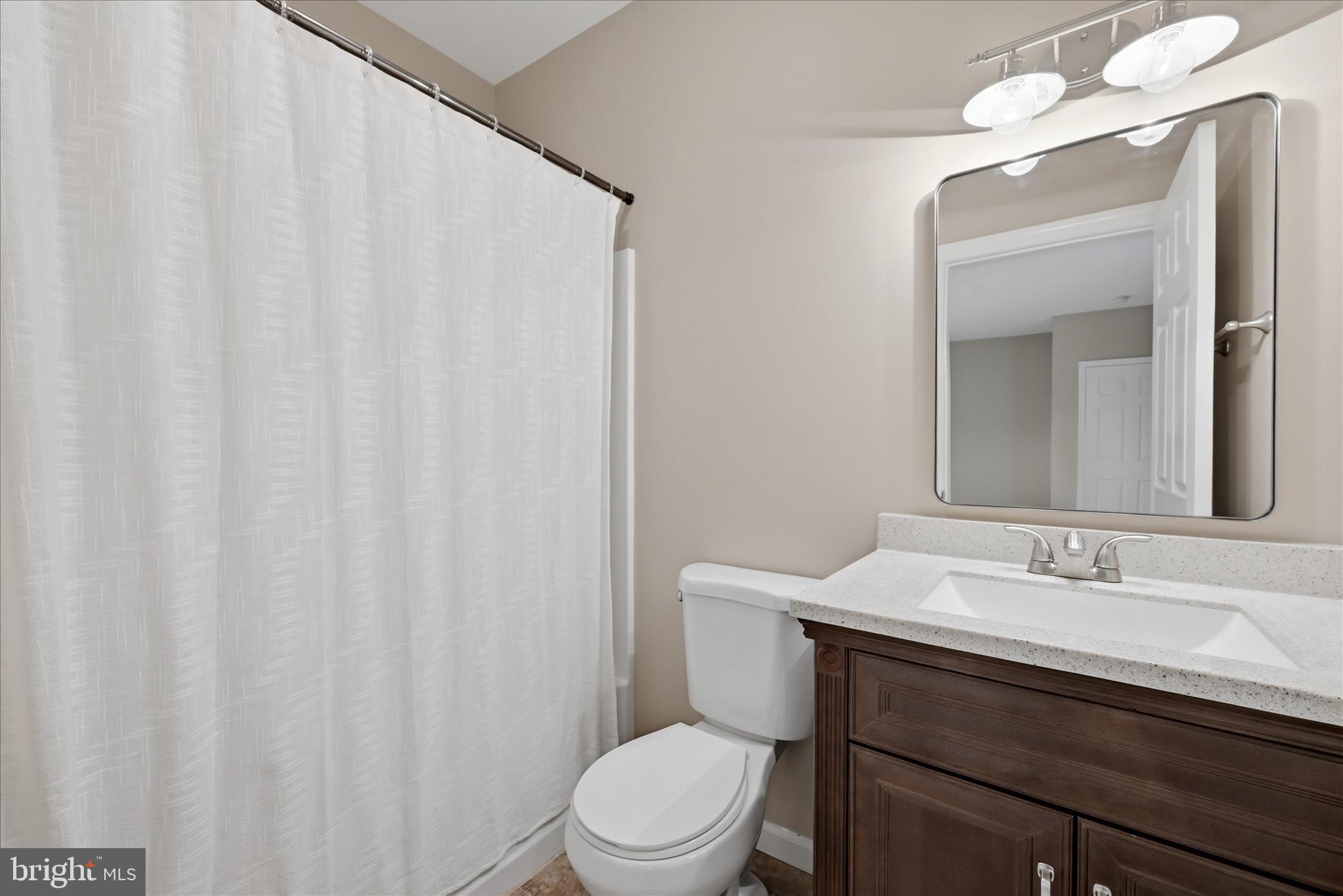 2230 Jones Road Winchester, VA 22602 - Photo 51 of 83 a bathroom with a sink vanity mirror and toilet